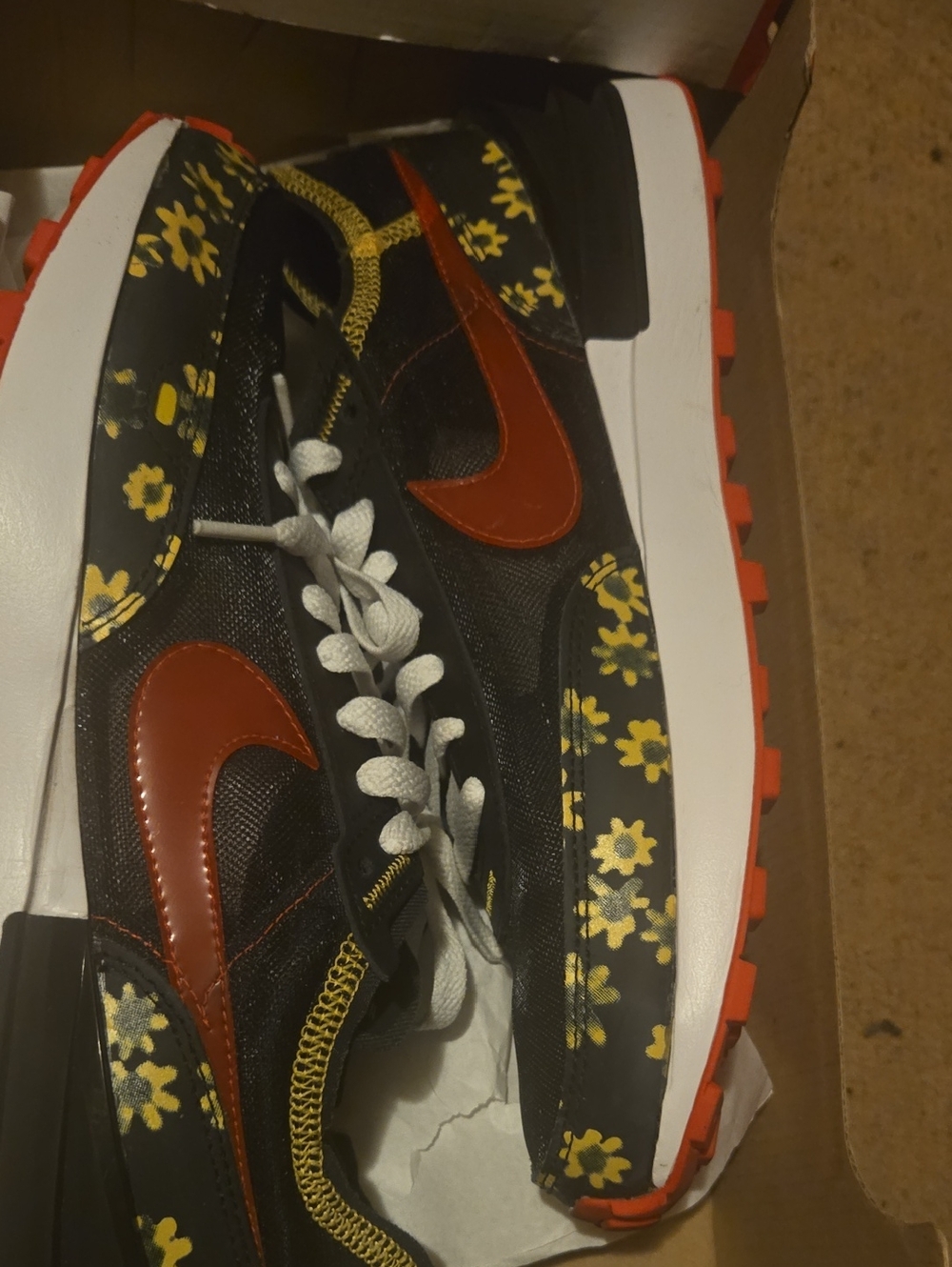 Nike Black Floral Runner with Red Swoosh and Yellow Accents